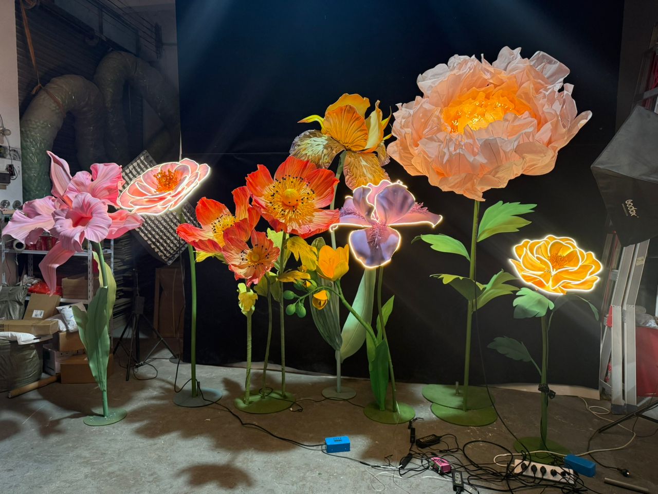 Towering illuminated giant blooms catching the eye in a styled environment